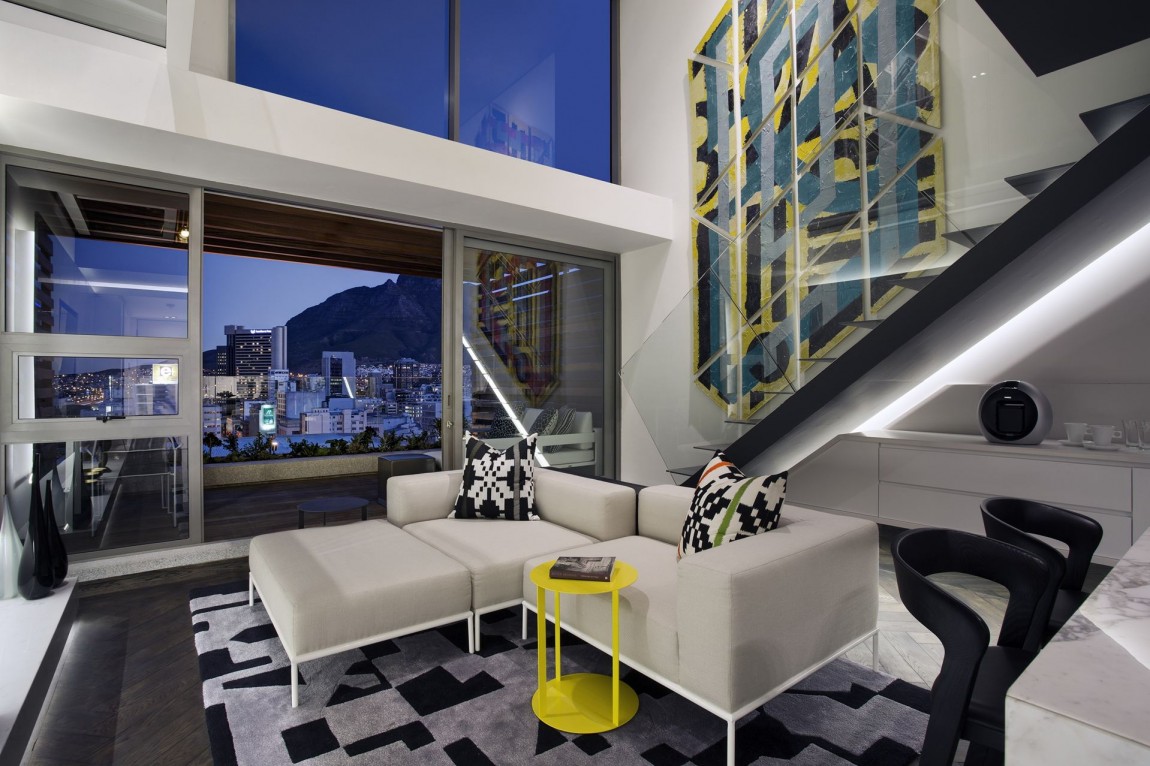 White sofa in small apartment by SAOTA, De Waterkant, Cape Town