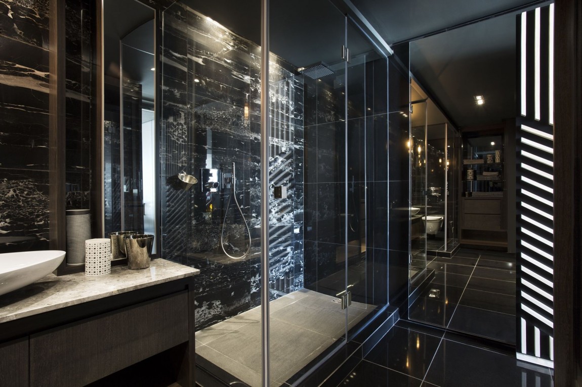 Modern black bathroom in small apartment by SAOTA, De Waterkant, Cape Town