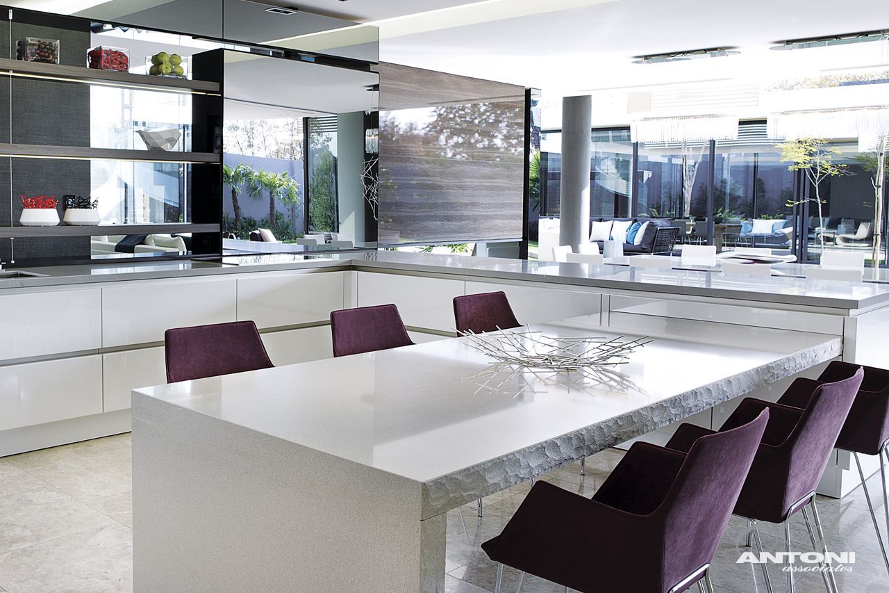 Dining room with white table and purple chairs