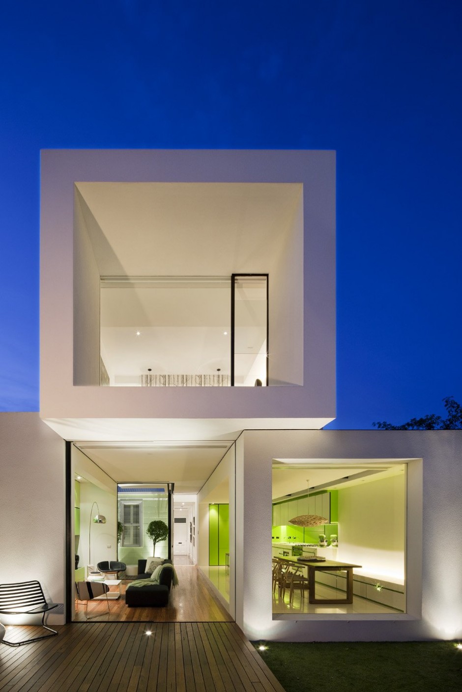 Facade of small minimalist home at night