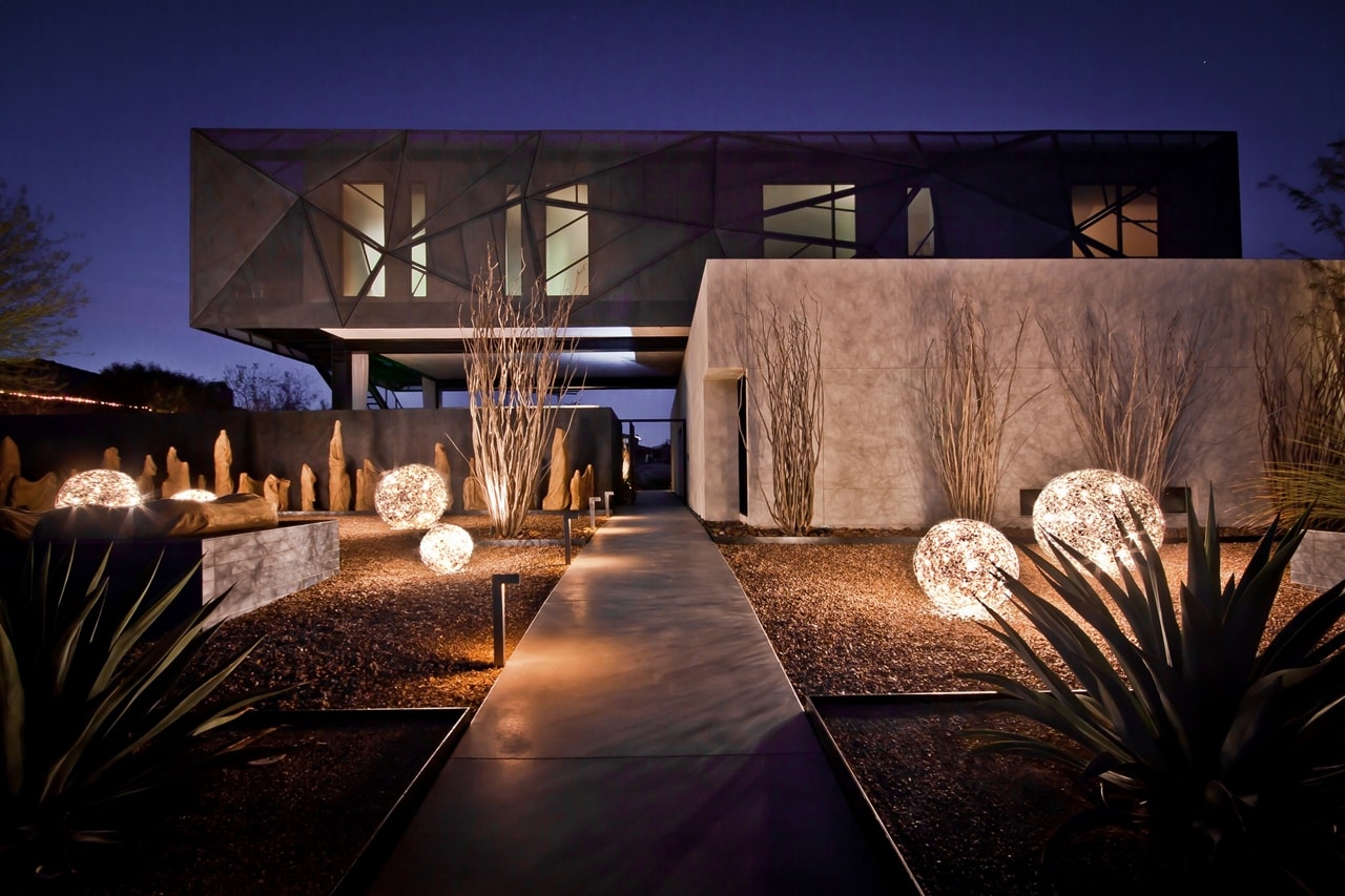 Night view of front yard in modern desert house designed by assemblageSTUDIO
