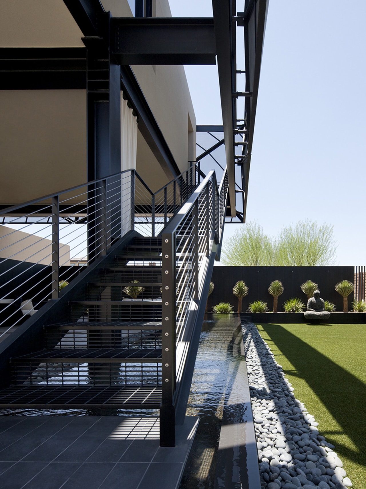 Outdoor metal staircase in modern desert house designed by assemblageSTUDIO