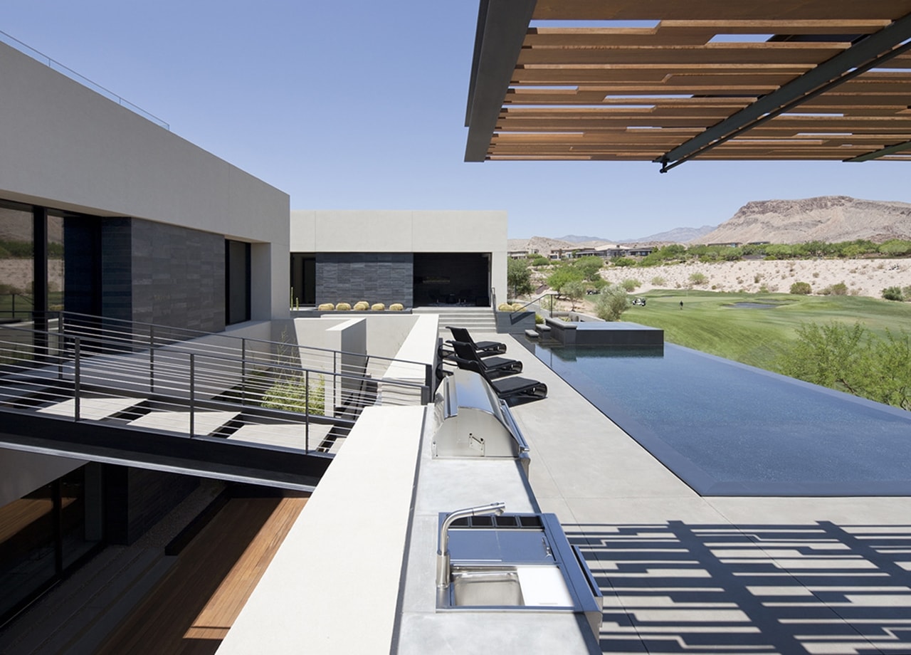 Upper deck with swimming pool in modern desert house designed by assemblageSTUDIO