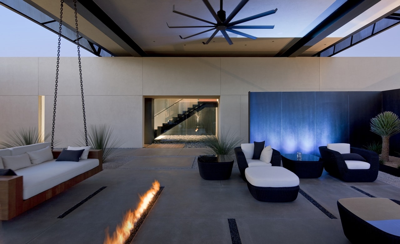 Modern terrace with fireplace in modern desert house designed by assemblageSTUDIO