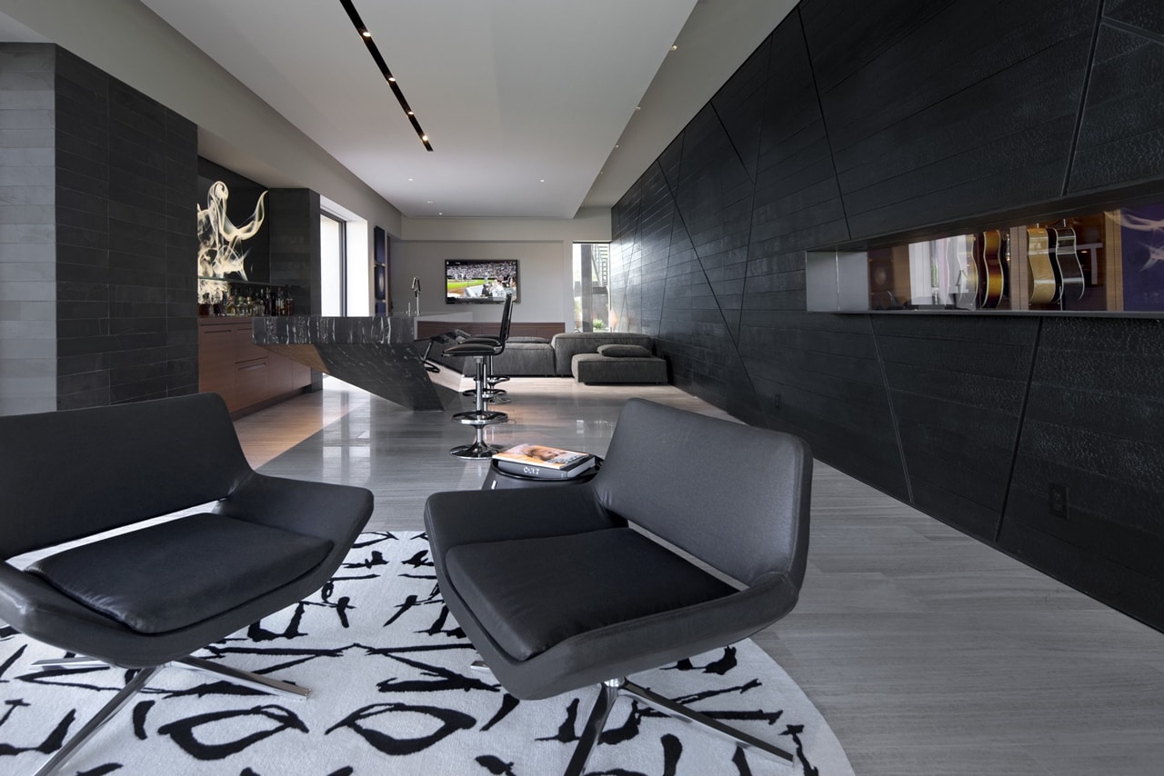 Modern dark chairs in modern desert house designed by assemblageSTUDIO