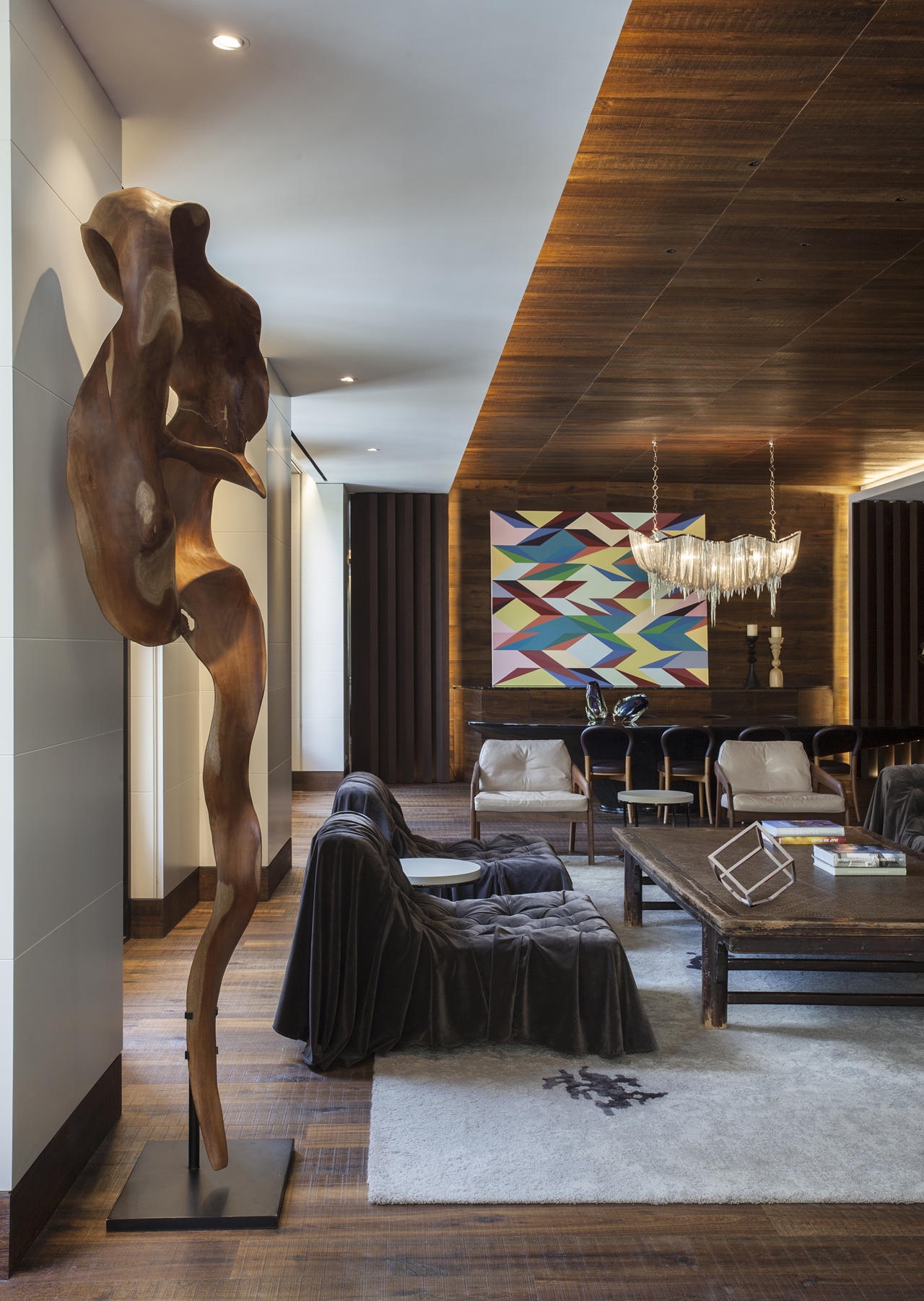 Wooden sculpture in interior design on Barcelona apartment by ARRCC