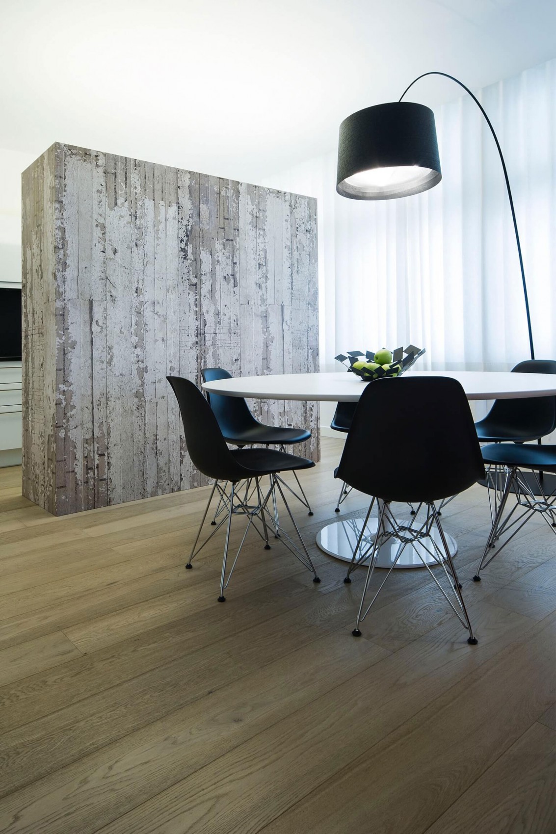 Dinning room in minimalist apartment by Filip Deslee