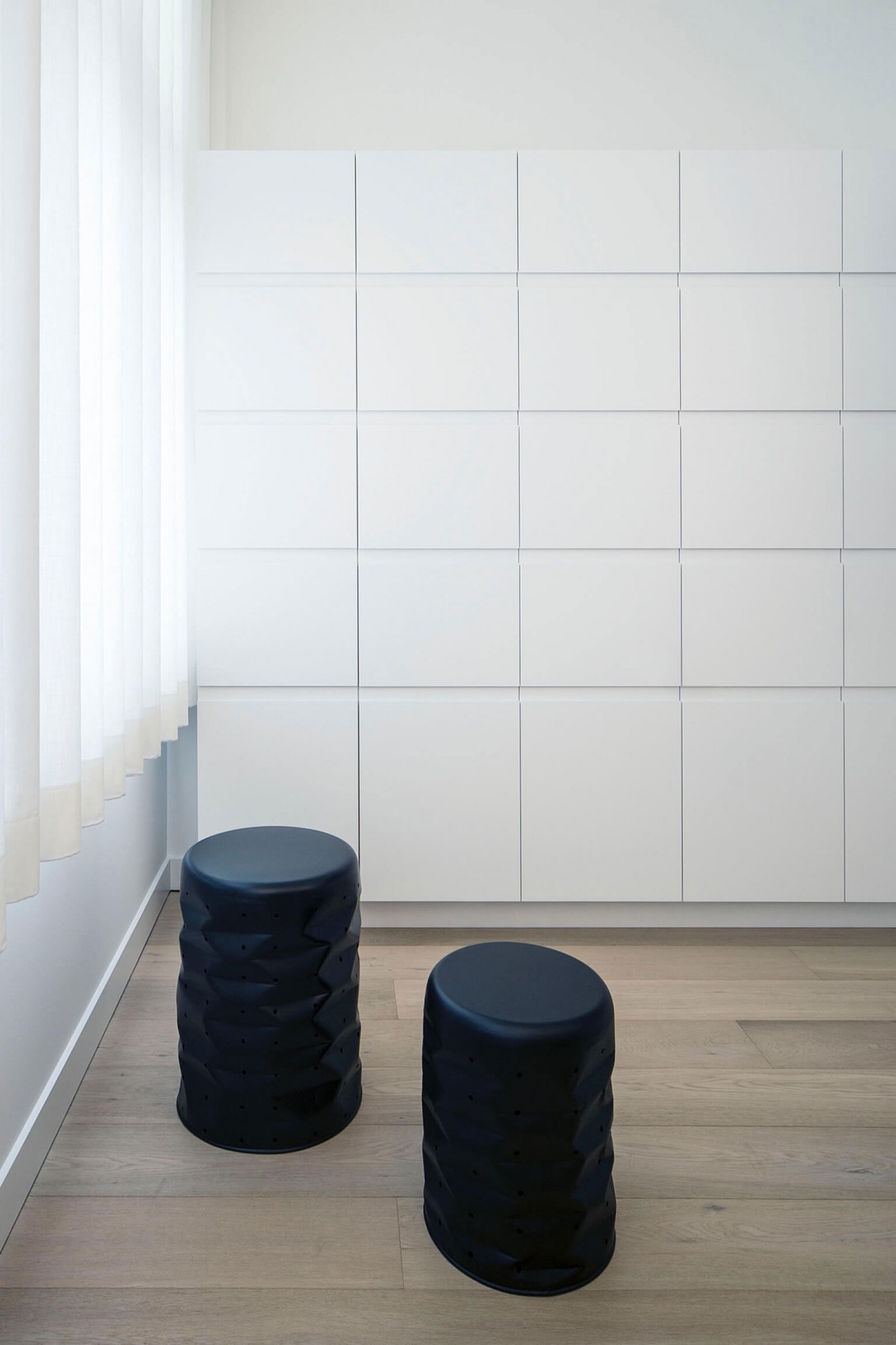 Furniture in minimalist apartment by Filip Deslee