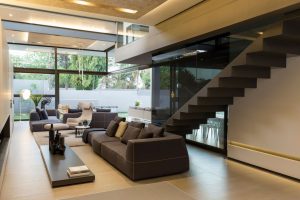 Living room and staircase in House Sar by Nico van der Meulen Architects