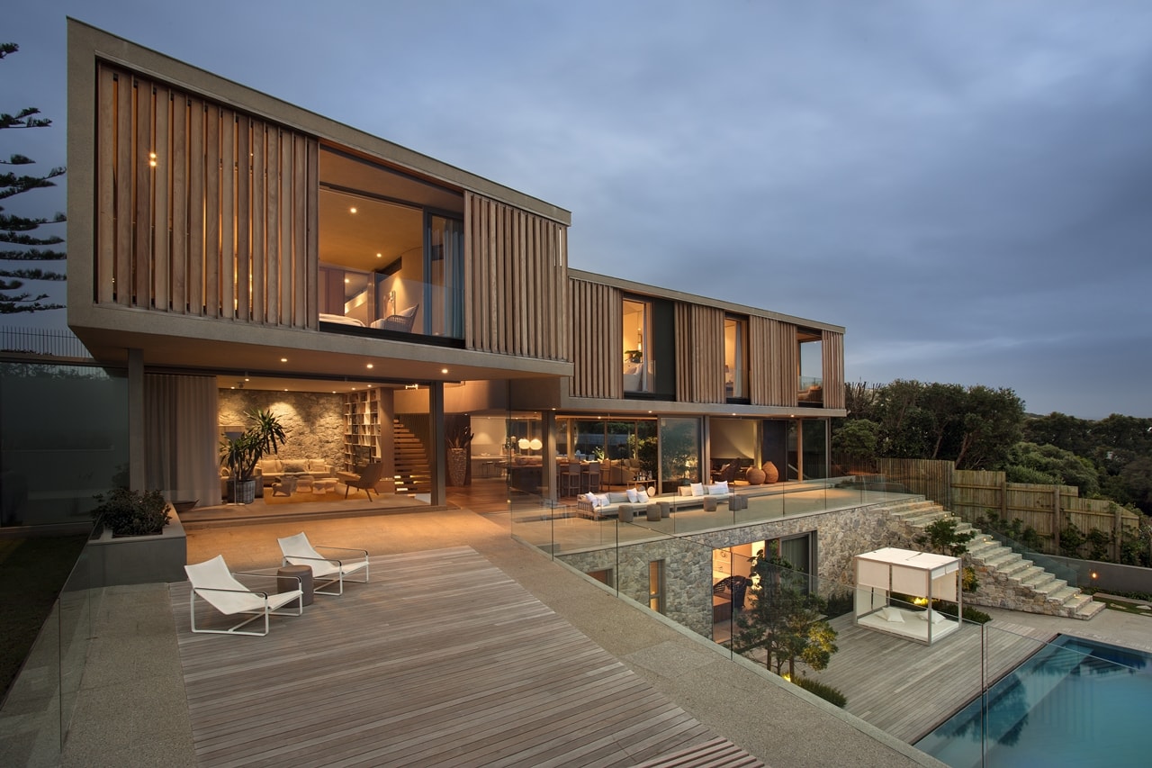 Terrace view of modern home with wooden facade by SAOTA