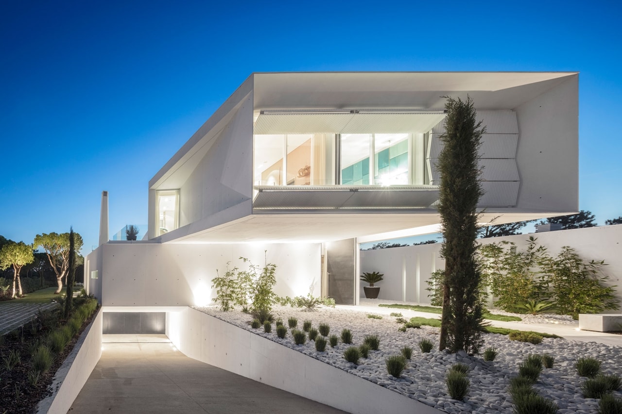 Incredible modern front facade lit up at night