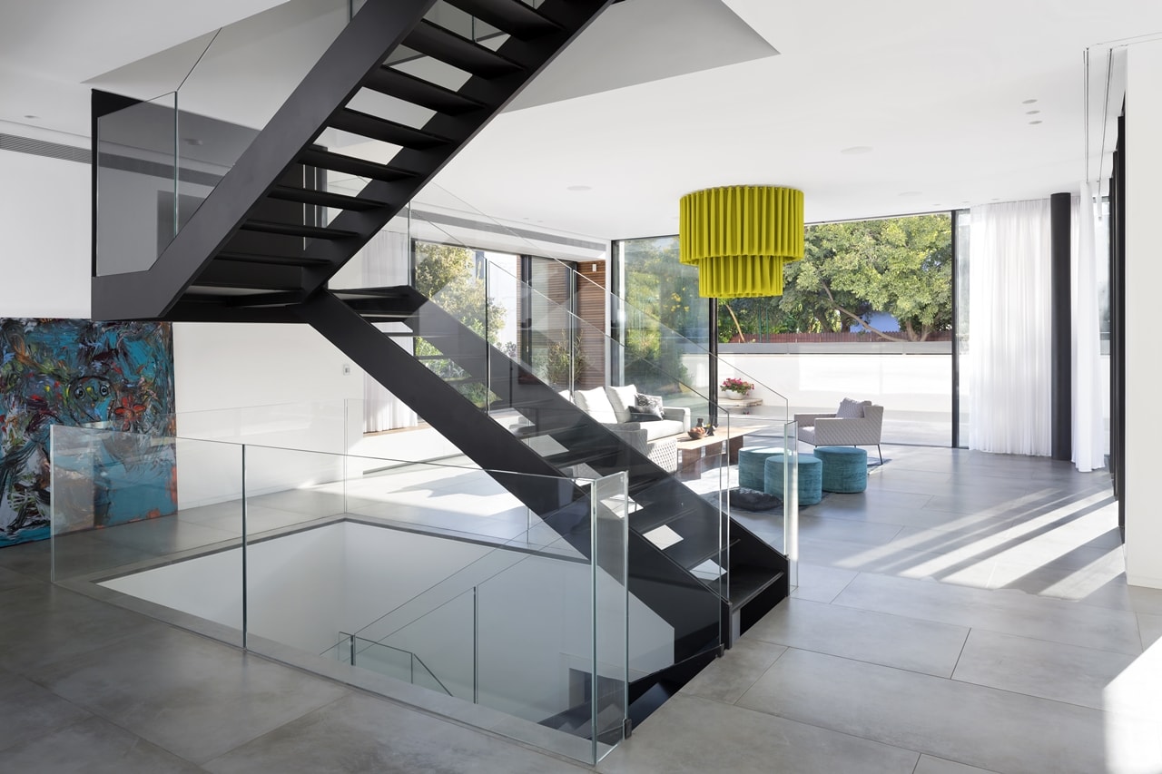 Steel staircase in modern home by Sachar-Rozenfeld Architects
