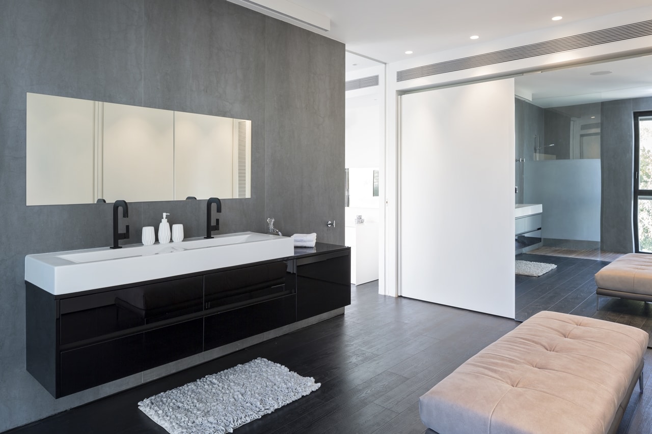 Black and white bedroom in simple modern home by Sachar-Rozenfeld Architects