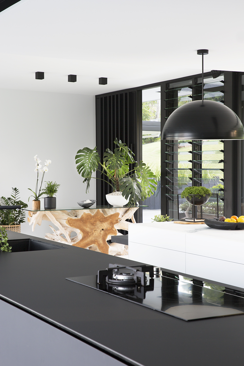 Black and white kitchen in Glasshouse by Sarah Waller