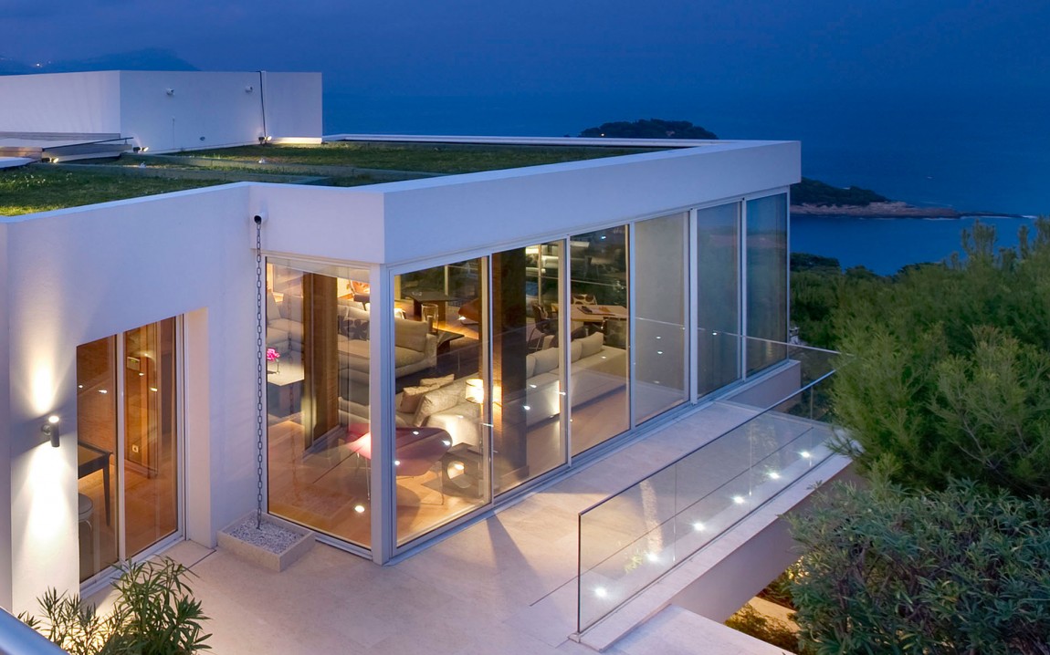 Exterior glass walls on modern mediterranean house