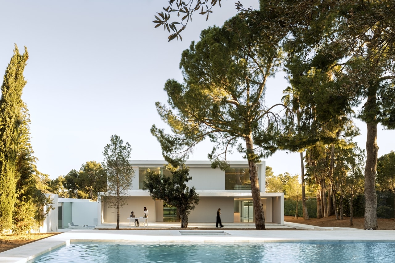Backyard swimming pool in minimalist house designed by Fran Silvestre Architects
