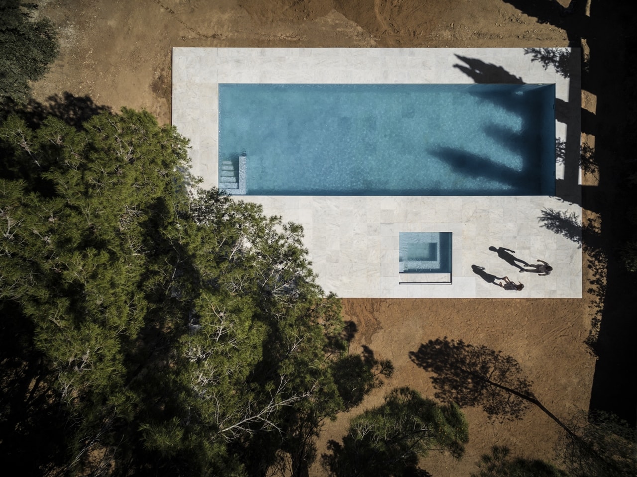Swimming pool in minimalist house designed by Fran Silvestre Architects