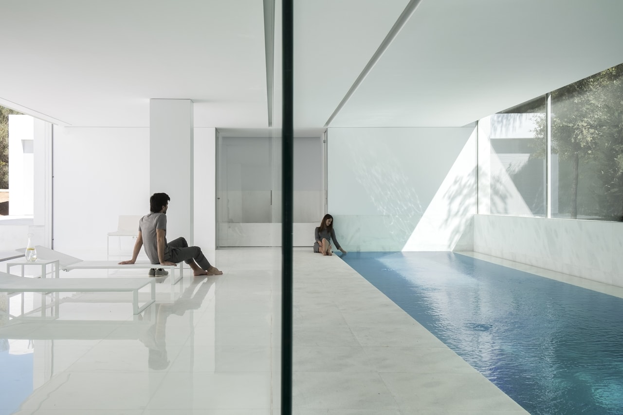 Indoor swimming pool in minimalist house designed by Fran Silvestre Architects