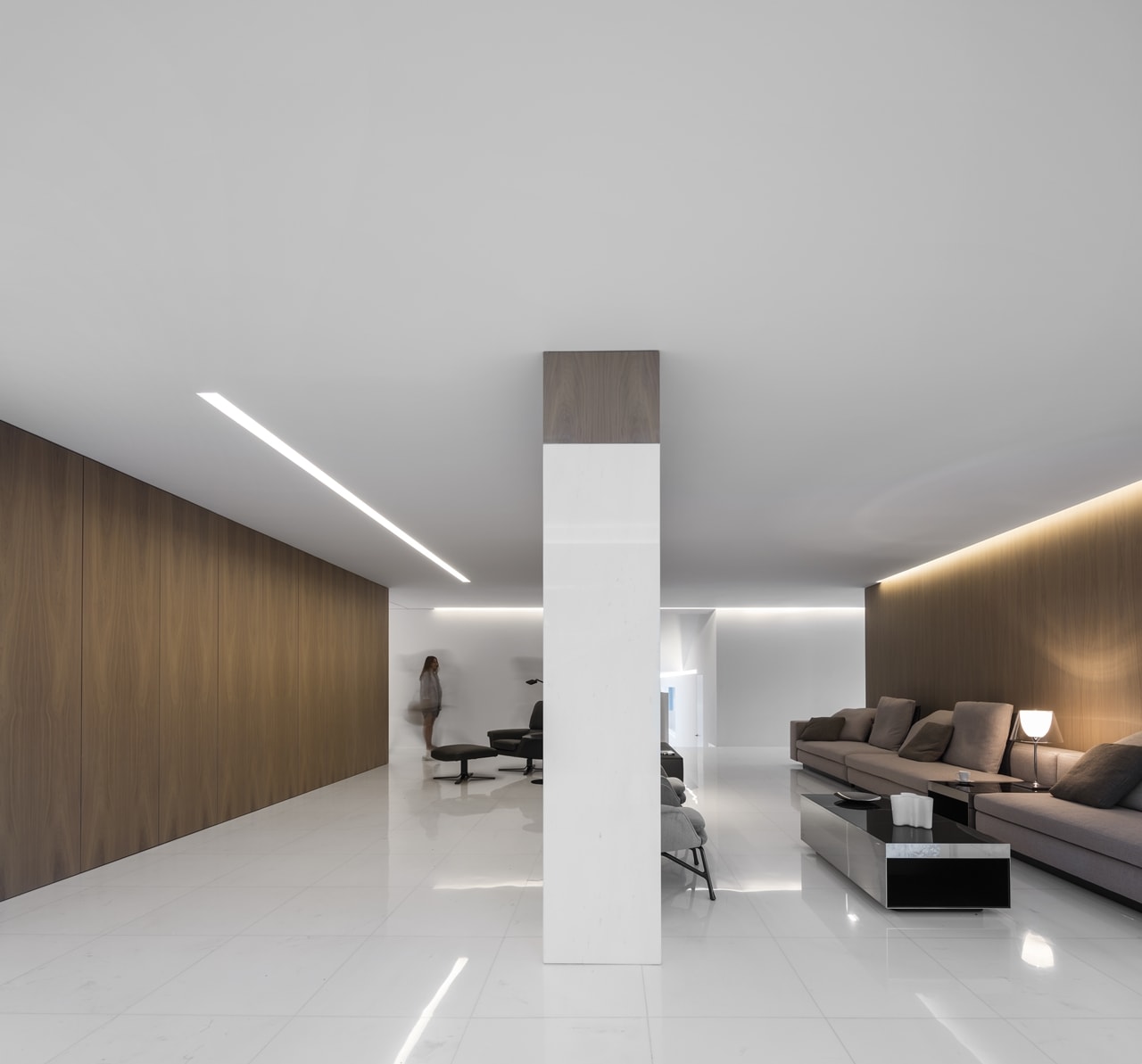 Modern brown and white living room in minimalist house designed by Fran Silvestre Architects