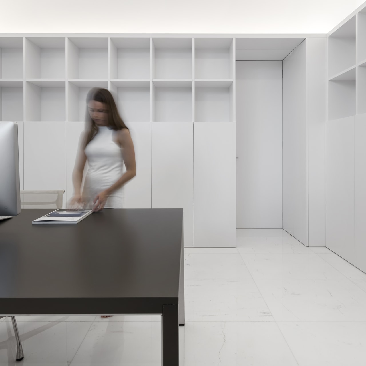 Dark desk in home office of minimalist house designed by Fran Silvestre Architects