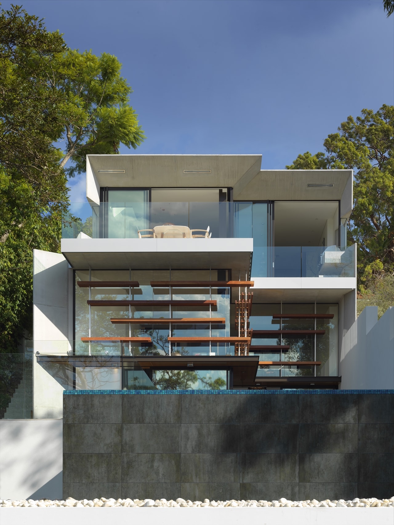 Infinity edge pool in the hillside house designed by Rolf Ockert