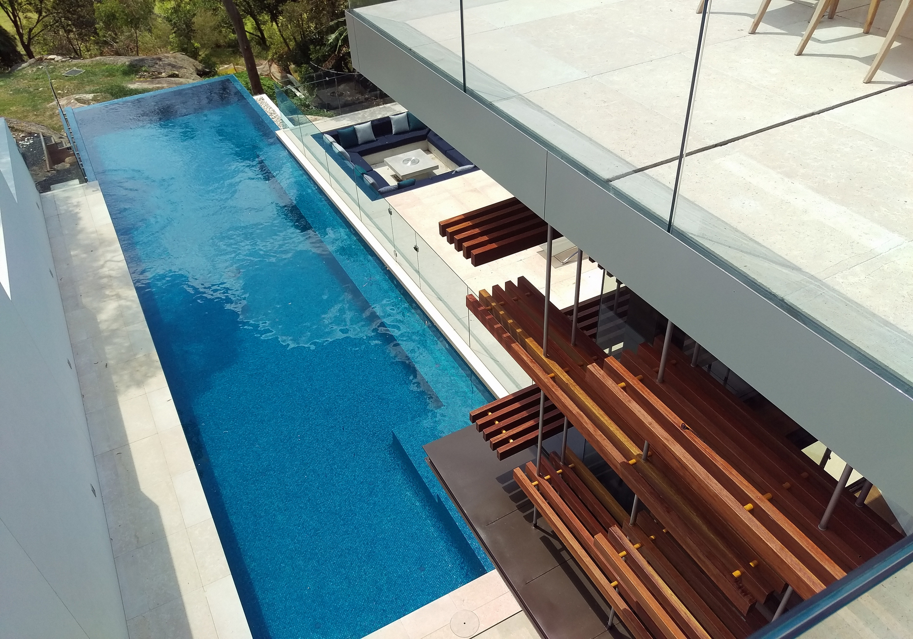 Modern swimming pool in the hillside house designed by Rolf Ockert