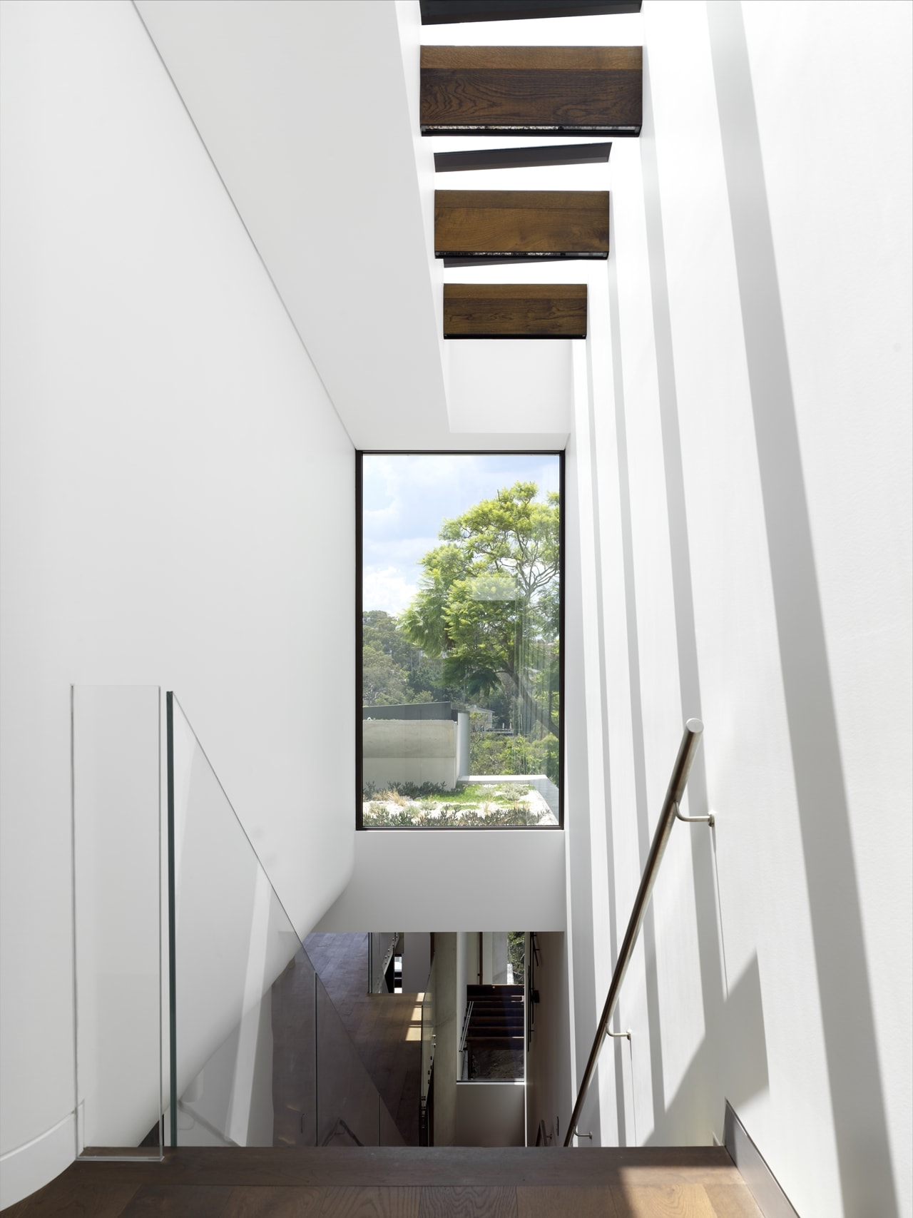 Simple staircase design in a hillside house designed by Rolf Ockert