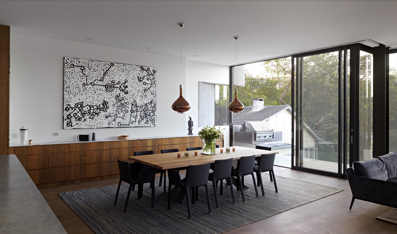 Modern dining room in hillside house designed by Rolf Ockert