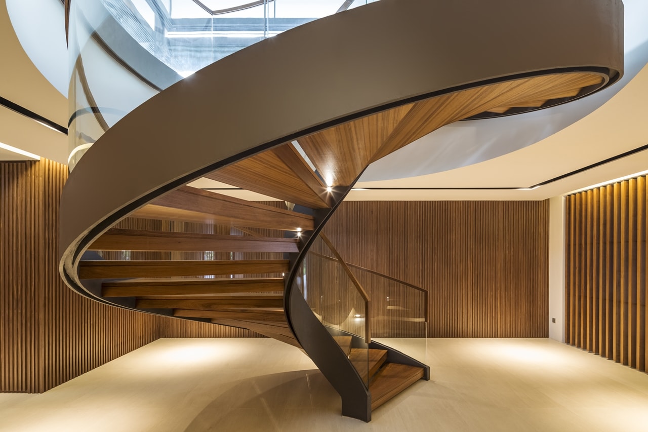 Modern steel and glass spiral staircase designed by Wallflower Architecture + Design