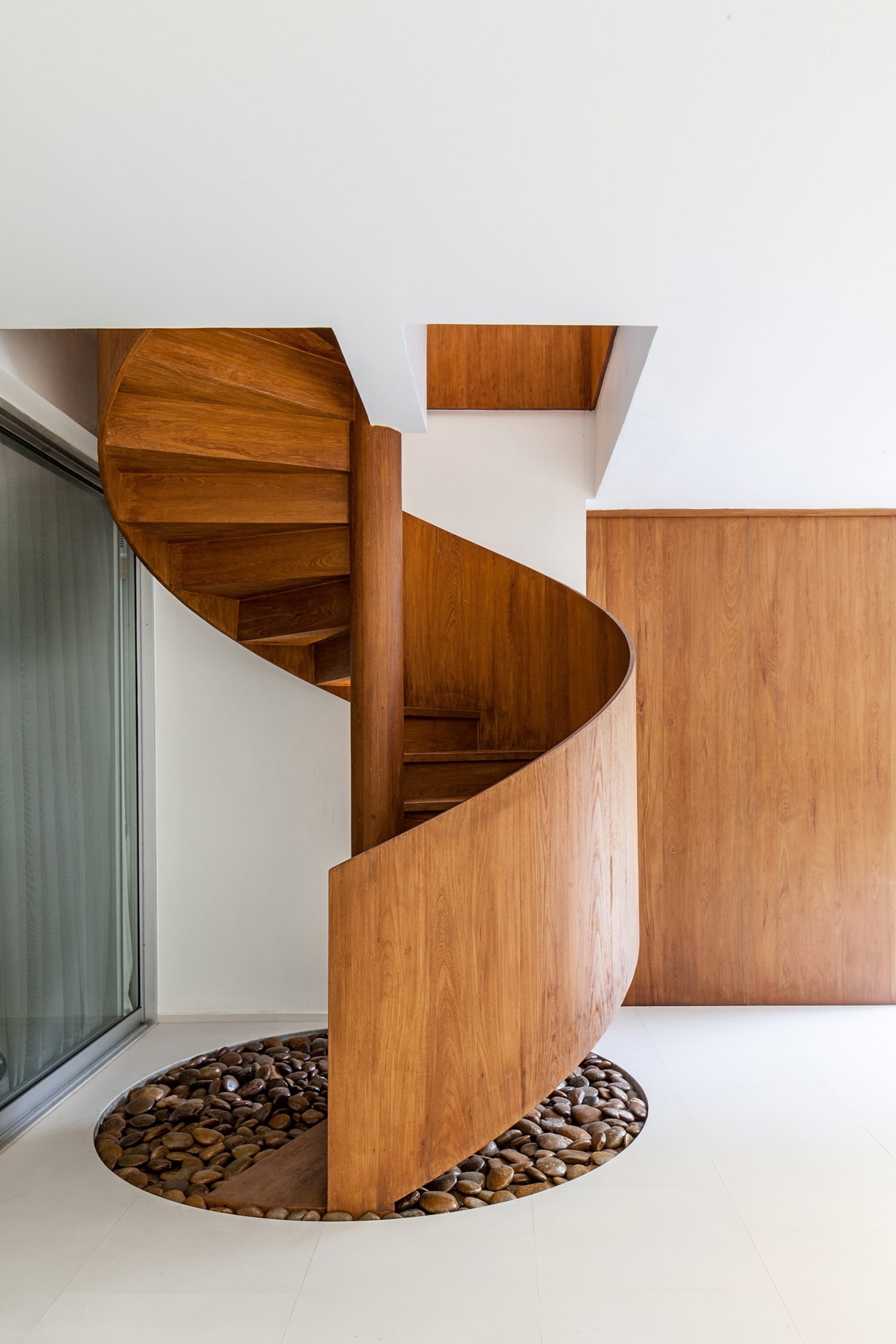 Wooden spiral staircase designed by Hypothesis Design Agency