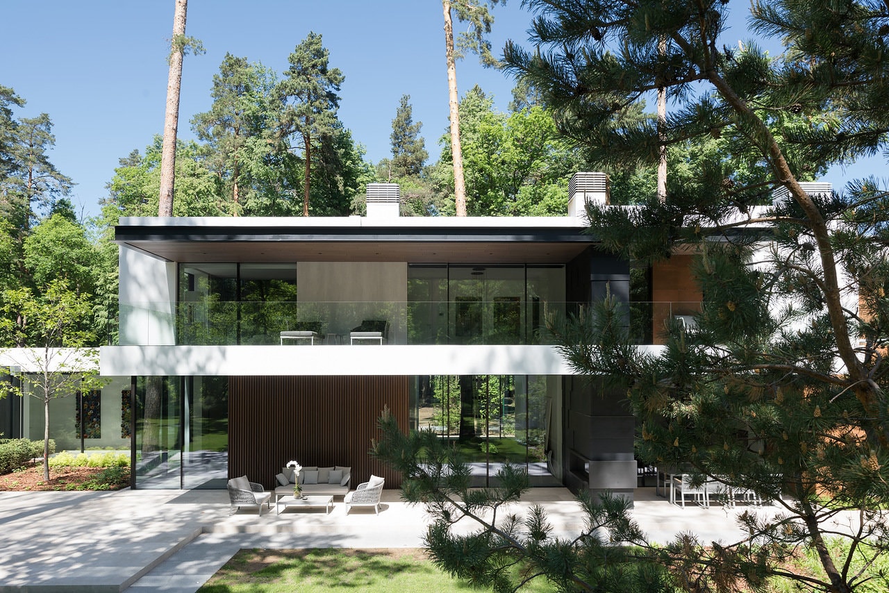 Glass walls on the facade of modern forest house designed by Alexandra Fedorova