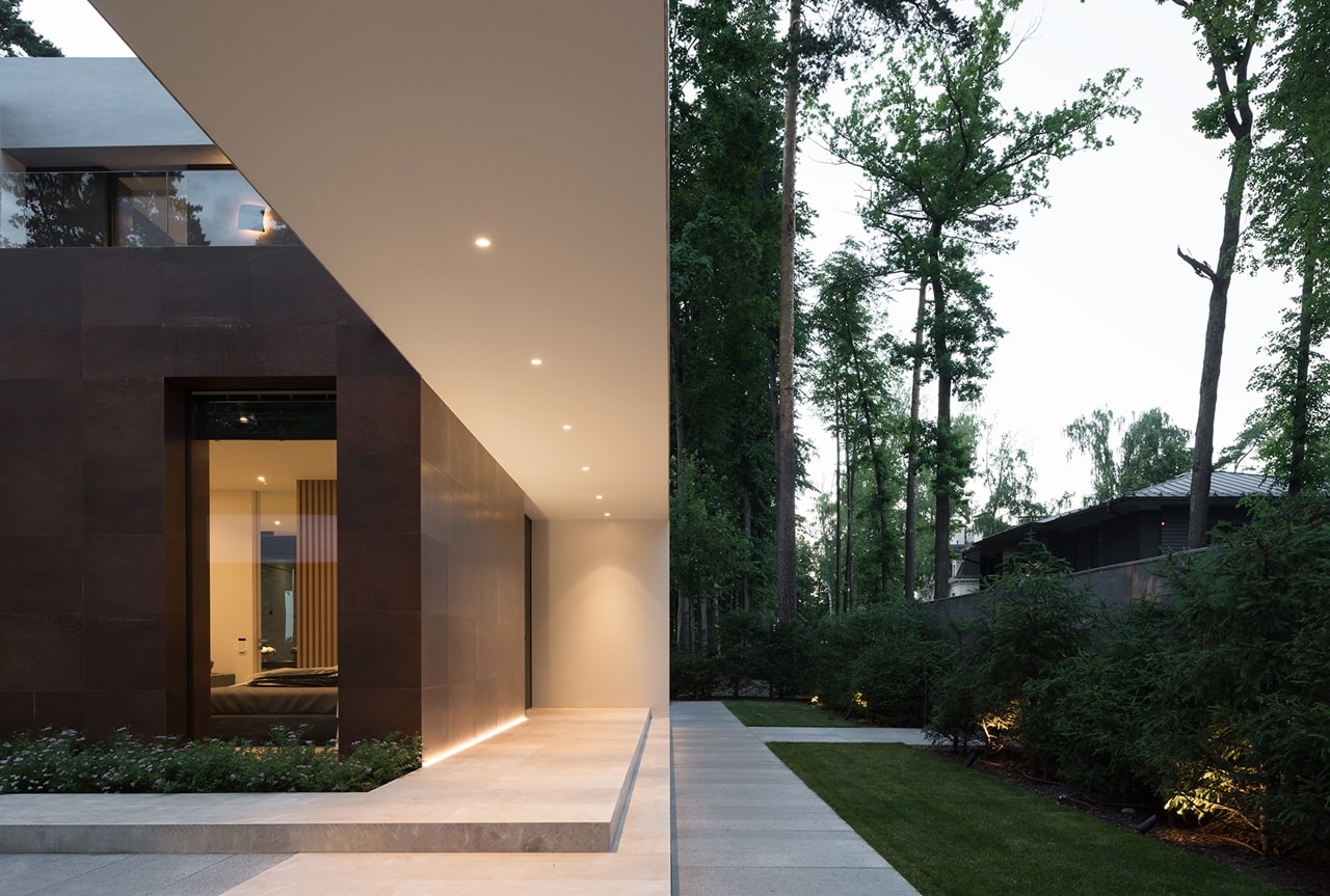 Entrance and front facade of modern forest house designed by Alexandra Fedorova